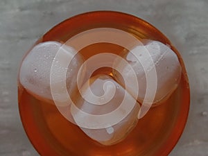 Ice coolers in an alcohol-based spritz cocktail drink seen from the top