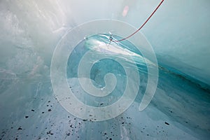 Ice Cove Franz Josef Glacier on a sunny day with climbing rope