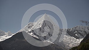 ice covered glacier of pyramid shaped mountain, laguna paron