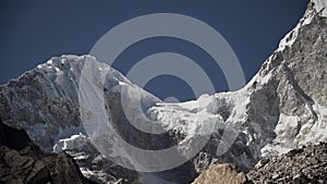 ice covered glacier of pyramid shaped mountain, laguna paron