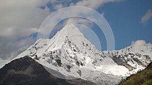 ice covered glacier of pyramid shaped mountain, laguna paron