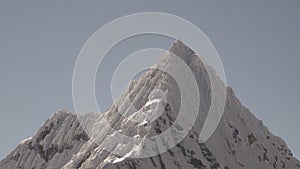 ice covered glacier of pyramid shaped mountain, laguna paron