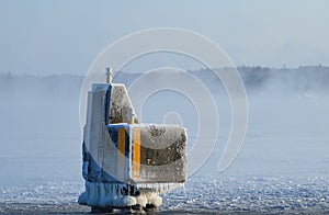 Ice covered mooring pollard or docking pillar