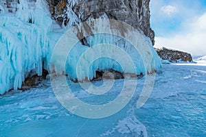 Ice-covered Ogoy Island in the Maloye More Strait of Baikal in winter. Siberia, Russia