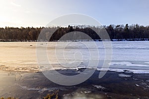 the ice-covered surface of the river in the winter season