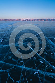 Ice crack in frozen Baikal lake in winter season, Siberia, Russia