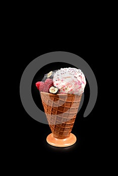 Ice cream with blueberries, blackberries and raspberries on a black background.  Copy space