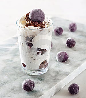 Ice cream with cherry berries marble countertop background