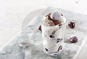 Ice cream with cherry berries on marble countertop background