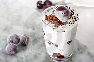 Ice cream with cherry berries on marble countertop background