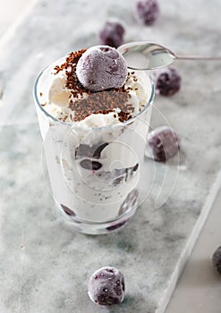 Ice cream with cherry berries on marble countertop background