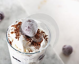 Ice cream with cherry berries on marble countertop background