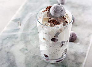 Ice cream with cherry berries on marble countertop background