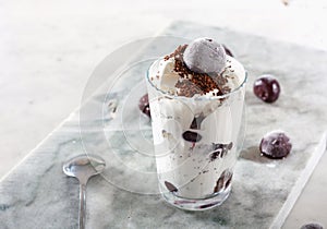 Ice cream with cherry berries on marble countertop background