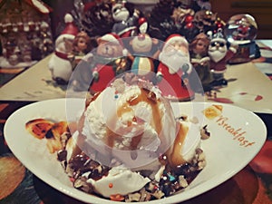 Ice cream in chocolate on the background of New Year`s toys