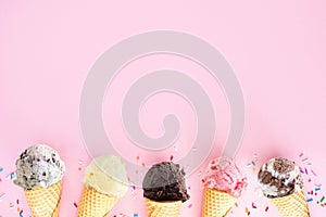 Ice cream cone bottom border over a pink background photo