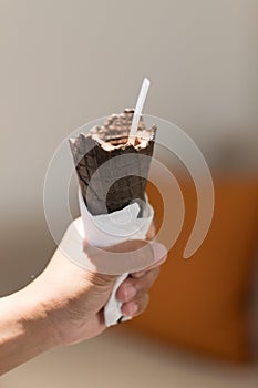 Ice cream cone choclate in hand photo