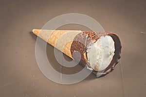 ice cream with cone in chocolate on a dark background/ice cream with cone in chocolate on a dark background, selective focus