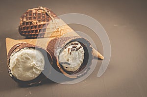 ice cream with cone in chocolate/ice cream with cone in chocolate on a dark background, selective focus and copy space