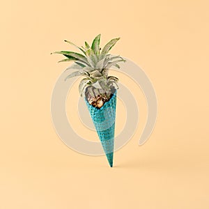 Ice cream cone with pineapple on pastel background