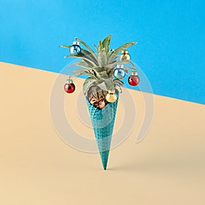 Ice cream cone with pineapple on pastel background