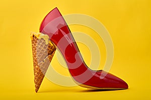 Ice cream cone`s used as a high heel.