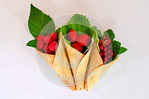 Ice cream cones with fruits. Fresh berry fruit, top view strawberry, raspberry and currant