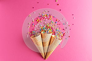 Ice cream cornets with colored sugar pearl