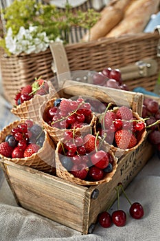 Ice cream cornets filled with fresh berries