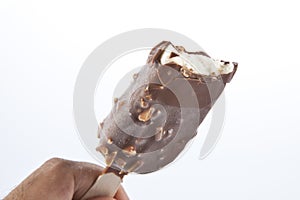 Ice cream covered with chocolate and almonds.