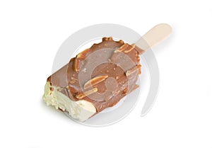 Ice cream covered with chocolate and almonds on white background