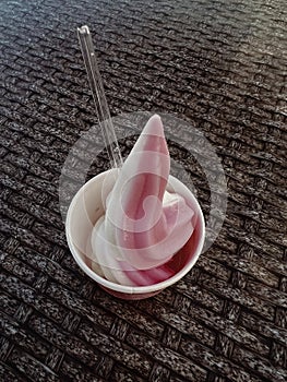 ice cream in a cup on the table. soft focus background.