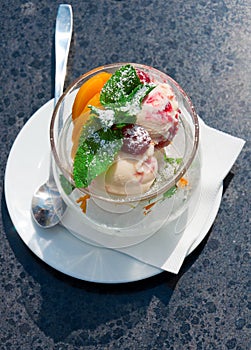 Ice cream in a glass on a black table