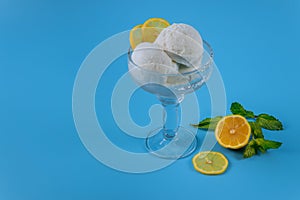 Ice cream with lemon on blue background