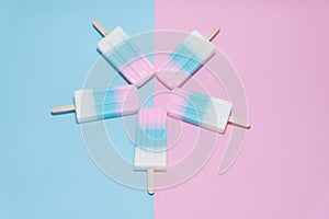 Ice cream over blue and pink background