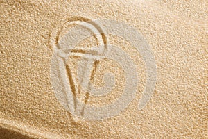 Ice cream is painted on sand. Beach background. Top view. The concept of summer, summer kanikkuly, vacation, holydays