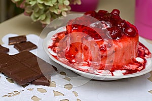 Ice-cream poured with cherry jam. photo