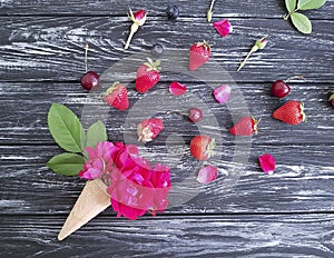 Ice cream rose creative cherry strawberry composition holiday on a black wooden background