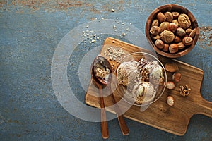 Ice cream scoop with nuts and cocoa