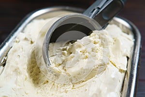 Ice cream scooped from container, close up