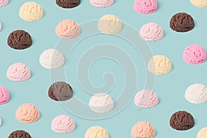 Ice cream scoops pattern with copy space on a pastel blue background.