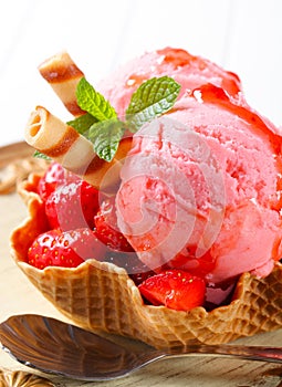 Ice cream with strawberries in wafer bowl