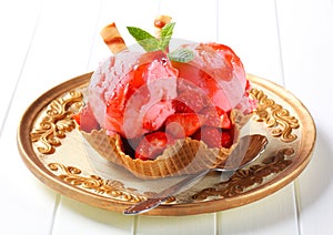 Ice cream with strawberries in wafer bowl