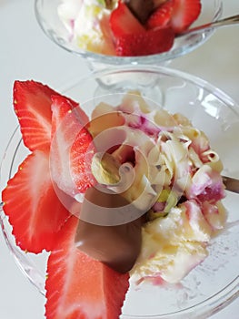 Ice cream with strawberry, chocolate and pistachio