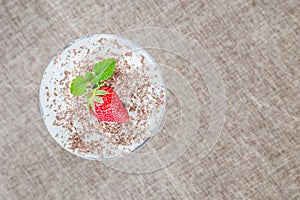 Ice cream with strawberry in glass. Summer and sweet menu concept. Top view