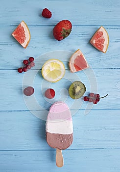 Ice cream summer milk dessert fresh cream flavor on a blue wooden background, , lemon, kiwi, pattern, strawberry