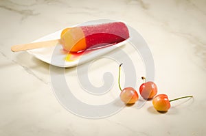 ice cream with sweet cherry berries/ice cream with sweet cherry berries on a white marble background