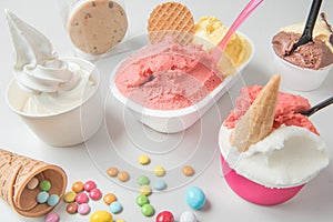 ice cream tubs in various fruit flavours with biscuits