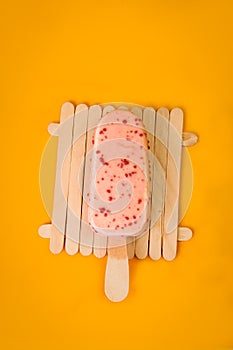 ice cream, very delicious pink on an orange background