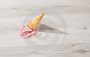 Ice cream in a waffle cone fell on floor